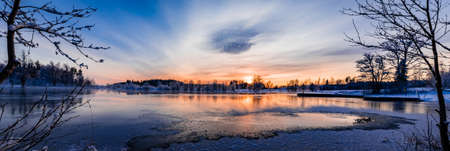 Sunset over a snowy and cold varmland, Swedenの写真素材