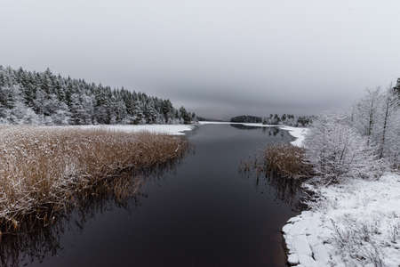 A snowy landscape overlooking water and iceの写真素材