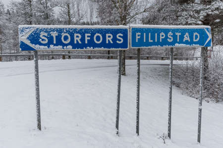 a wintery cross road with signs Storfors and Filipstadの写真素材