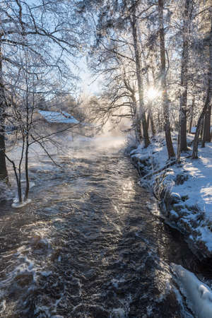 sunrise over water at Knappforsen Lunedet near Karlskoga Swedenの写真素材