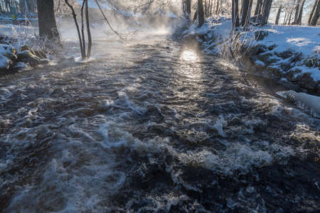 sunrise over water at Knappforsen Lunedet near Karlskoga Swedenの写真素材
