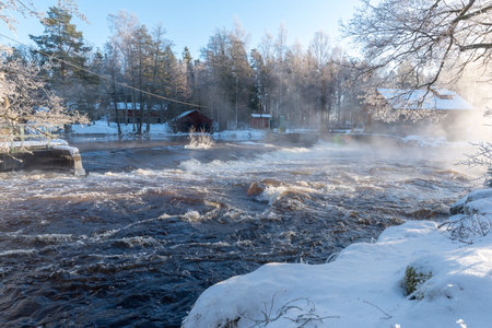 sunrise over water at Knappforsen Lunedet near Karlskoga Swedenの写真素材