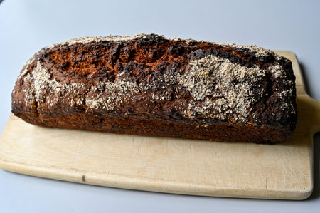 home made loaf of bread on cutting board