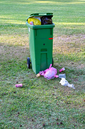 trashcan ful at bathing area early in the morning