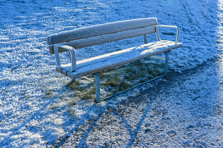 parkbench in public park a cold day in december