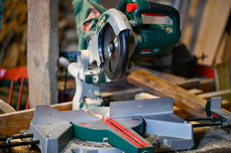 workshop with Bosch miter saw on tableのeditorial素材
