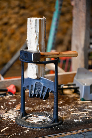 Kindling Cracker with small sledge hammer in workshopのeditorial素材