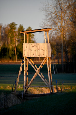 hunting tower standing in agriculture field early morningの写真素材
