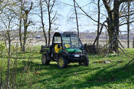 Working car standing in green nature reserve