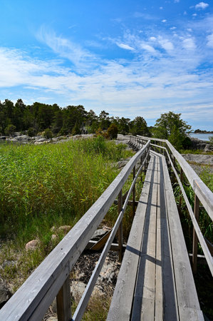 wooden foot bridge over water from to ilandの写真素材