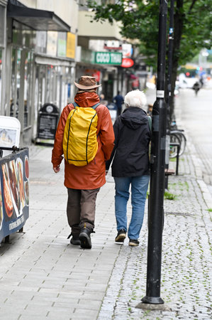 Old couple walking in Orebro city center Orebro Sweden august 9 2023のeditorial素材