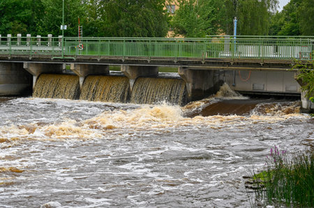 Open hatches in small dam Orebro Sweden august 9 2023のeditorial素材