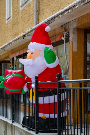 Big inflated Santa Claus standing outsid shopの写真素材