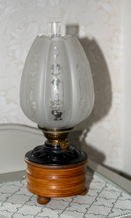 Old beautiful oil lamp with big frosted glass screenの写真素材