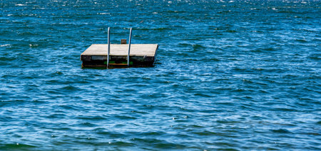 Floating jetty with bathing ladder in lake Vattern Motala Sweden