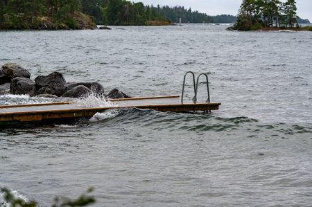 Bathing jetty in windy weather Vastanvik Motala Swedenの写真素材