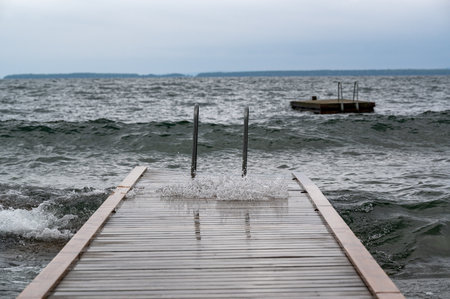 Bathing jetty in windy weather Vastanvik Motala Swedenの写真素材