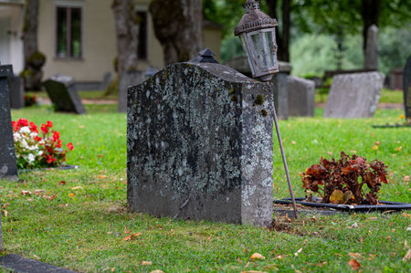 Graveyard with grave stones in rows and flowersの写真素材