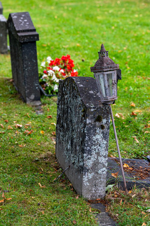 Graveyard with grave stones in rows and flowersの写真素材