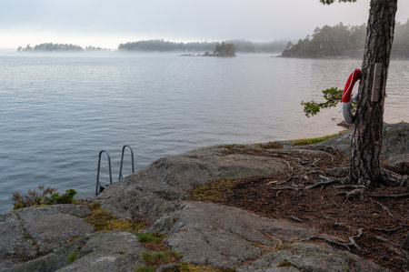 bathing ladder to the cold water of Lake Vattern Motala Swedenの写真素材
