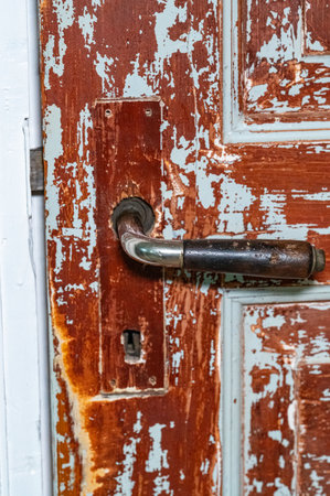 Closeup of door handle on old door in houseの写真素材
