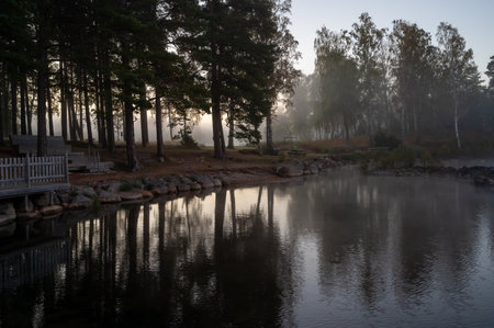Sunrise a misty calm morning Vastanvik Motala Swedenの写真素材