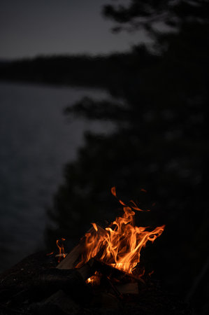 Orange flames from fire outside on a hikeの写真素材