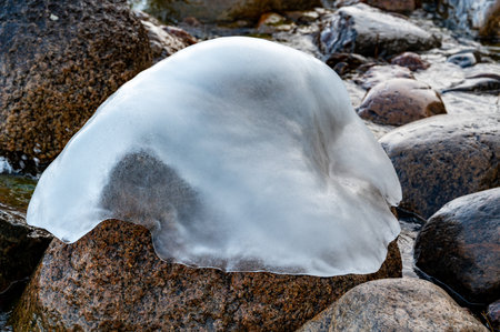 Stone covered in a ice hat Motala Swedenの写真素材