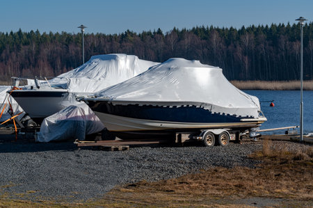 Two motor boats with plastic cover for winter storageの写真素材