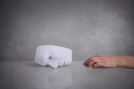 The mask is a symbol of duplicityの写真素材