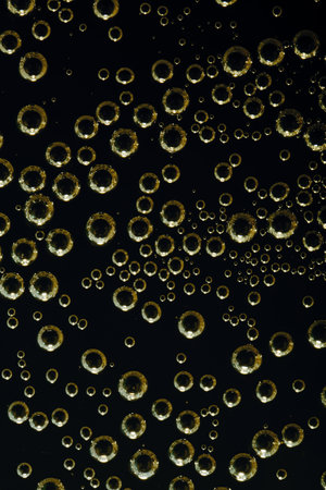 Golden air bubbles on blackの写真素材