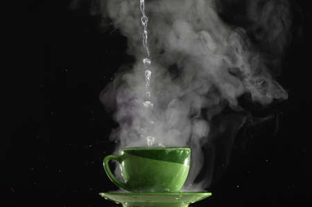 Pouring very hot water into the cupの写真素材
