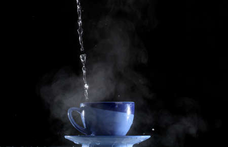 Pouring very hot water into the cupの写真素材