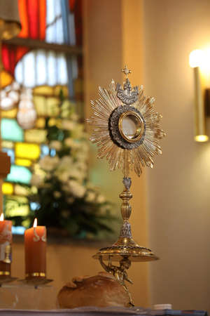 Golden monstrance stands on the altar in the Church
