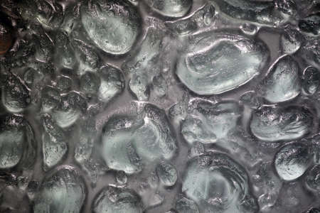 A large drop-shaped glass background.