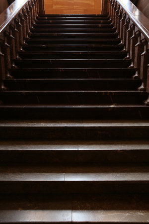 Long old dark stairs from a natural stoneの写真素材