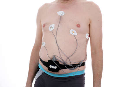 European white man wearing a holter who records a heart work.の写真素材