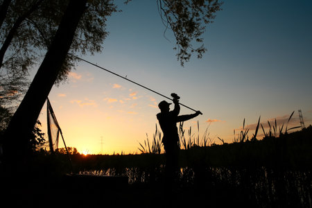 The young angler catches large fishの写真素材