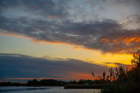 Beautiful sunset over the lake with clouds in the sky
