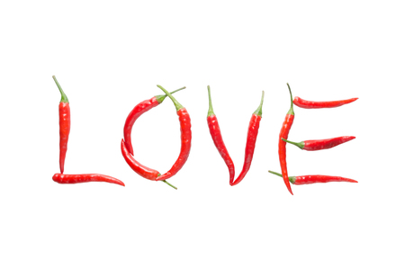 Love letter from red chili isolated on white backgroundの写真素材