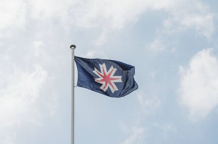 Waving hokkaido flag on poleの写真素材