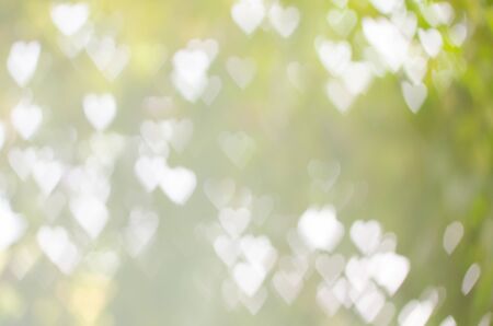 Abstract background heart shape bokeh in green toneの写真素材