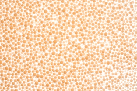 Abstract background from orange styrofoam ball texture