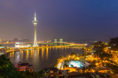 Night view of macau tower and sai van bridge at macau chinaの写真素材