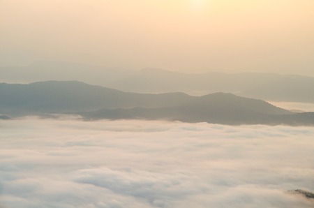 Sunrise sky and misty layer mountain in the morning at sri nan national park thailandの写真素材