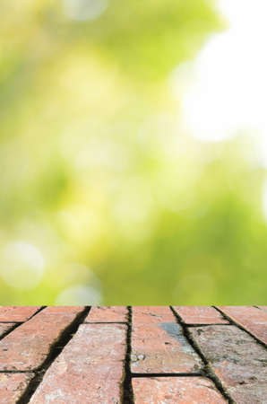 Brick floor and green bokeh abstract background ,can be used for display your productsの写真素材