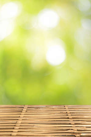 Empty wood table and green bokeh abstract background ,can be used for display your productsの写真素材