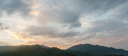 Beautiful sunset sky and cloud over the mountainの写真素材