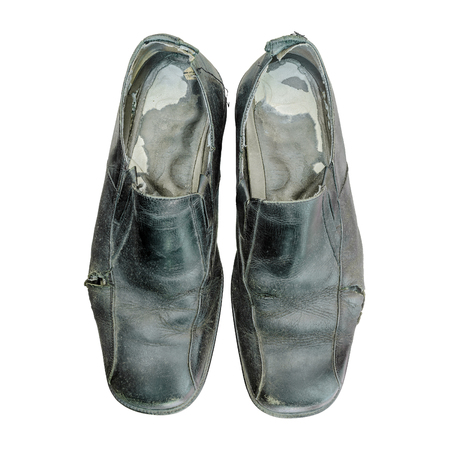 Dirty and old shoes isolated on white backgroundの写真素材