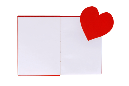Paper heart on blank open book isolated on white backgroundの写真素材